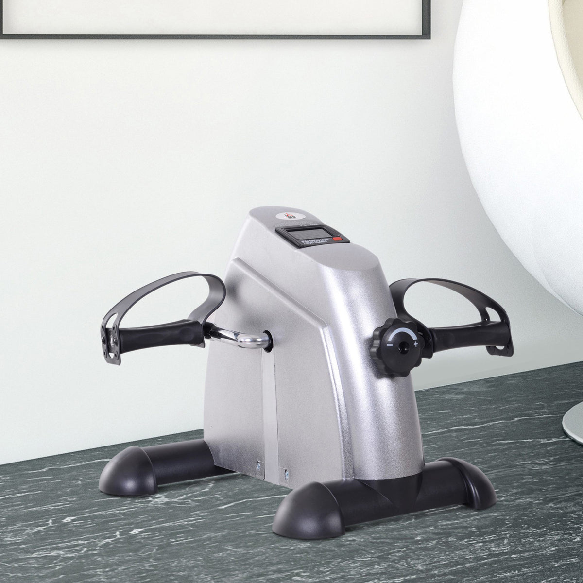 Pedal exerciser under a desk